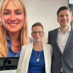 drei Personen vor einem Bildschirm, Frauengesicht auf Bildschirm