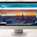 Mock-up eines Monitors mit den Webinhalten