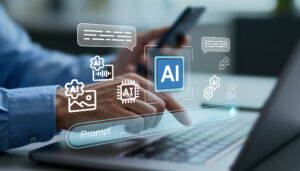 Eine Person tippt auf einem Laptop, darüber schweben Sprechblasen und AI-Zeichen.
