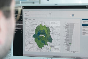 Blick auf einen Monitor mit einer Karetendarstellung von Münster und umliegenden Gemeinden