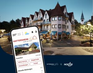 Hattersheim-App auf einem Smartphone vor einem Gebäude